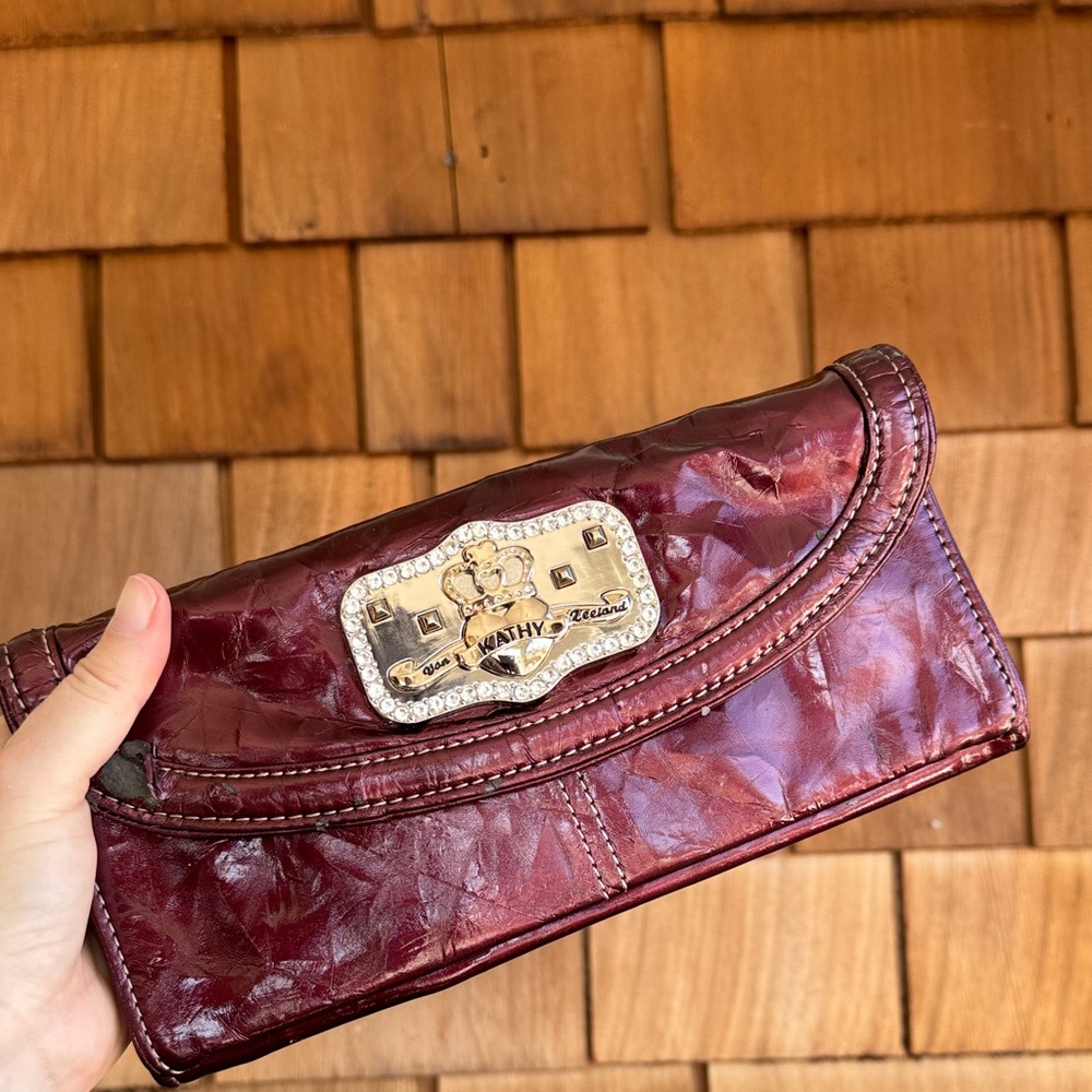 Kathy Van Zeeland Burgundy Patent Clutch with Decorative Plaque